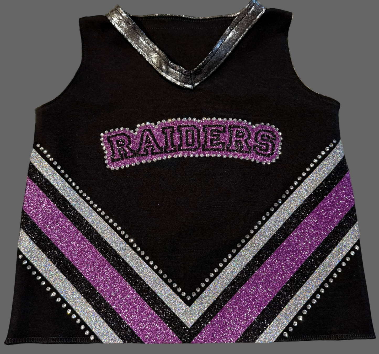 Black tank top with purple and gray striped design and 'RAIDERS' text on a textured surface